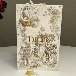 Dior limited edition Holiday Gift Bag with Star Charm 
Gold and white tote bag